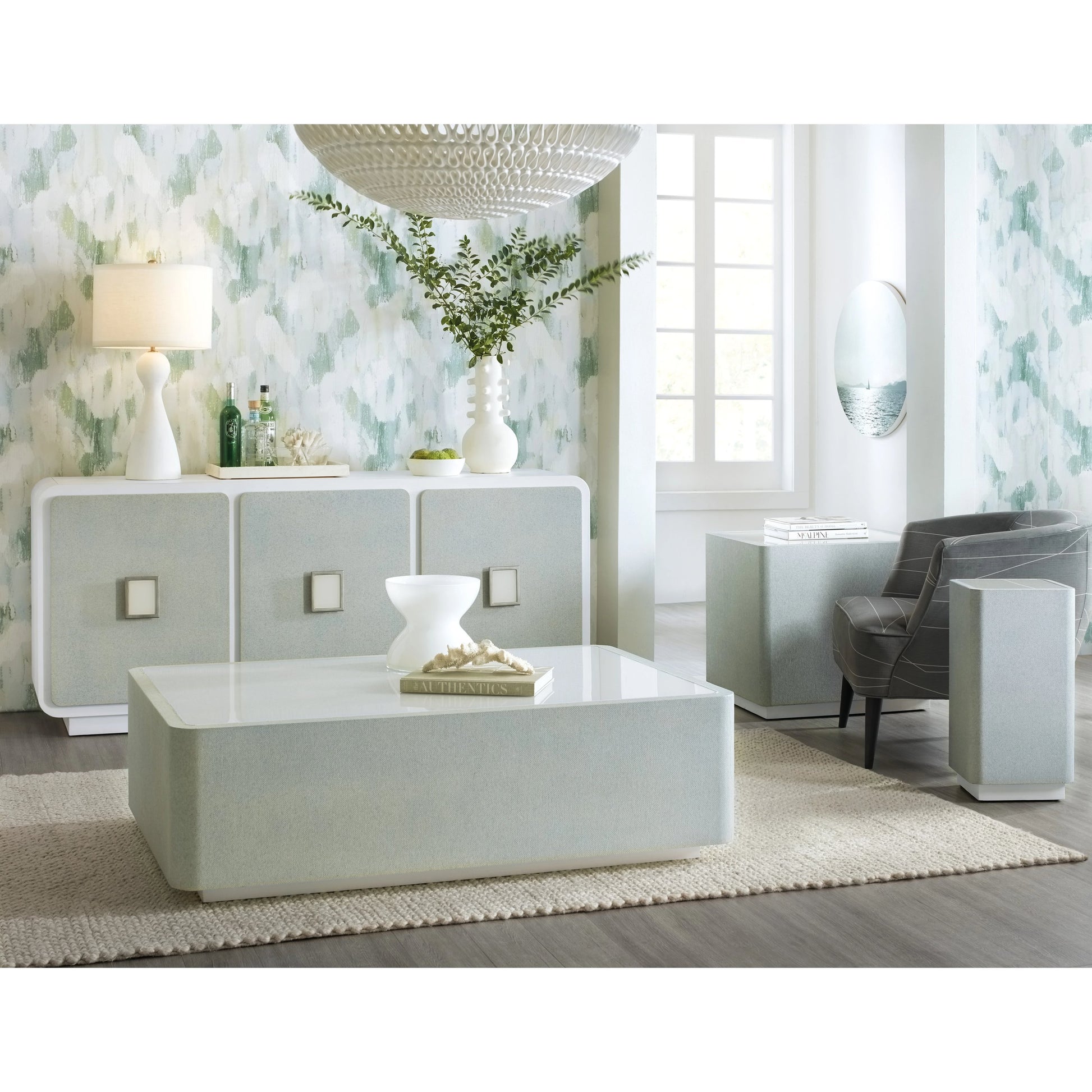 Melange Atlantis Entertainment Credenza by Hooker Furniture in cream, pale blue. Made from pine veneers, raffia, painted glass in a modern style.