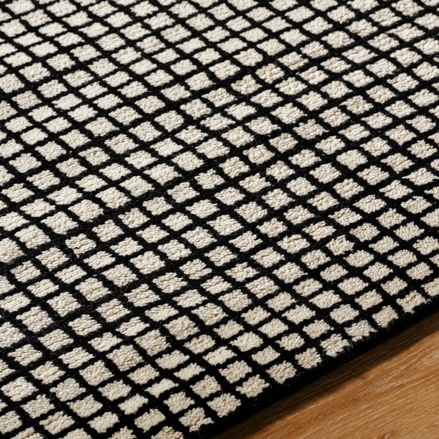 004 SI-2050664,SI-2050665,SI-2050666,SI-2050667,SI-2050668 | Closeup | Damier DMI-2300 Rug by Surya in cream, black. Made from face: 100% wool, warp: 100% cotton in a unique style.