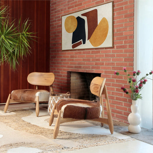 Guleen Occasional Chair by Arch & Plane in brown, white hide, natural wood. Made from teak wood, goat hide seat in a cottage & farmhouse style.