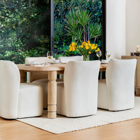 Louise Dining Table by Arch & Plane in light natural. Made from mindi wood veneer in a unique style.