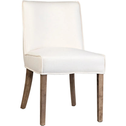 Rosia Dining Chair by Arch & Plane in off white upholstery, grey washed wood finish. Made from linen blend upholstery, rubber wood legs in a transitional style.