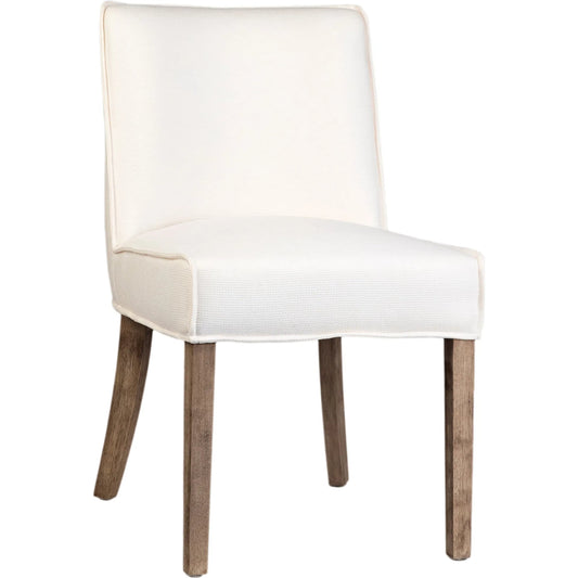 Sizan Dining Chair by Arch & Plane in off white upholstery, grey washed wood finish. Made from linen blend upholstery, rubber wood legs in a unique style.
