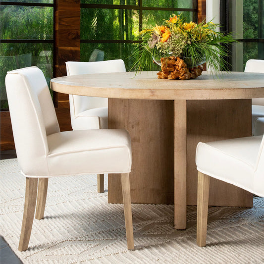 Sizan Dining Chair by Arch & Plane in off white upholstery, grey washed wood finish. Made from linen blend upholstery, rubber wood legs in a unique style.