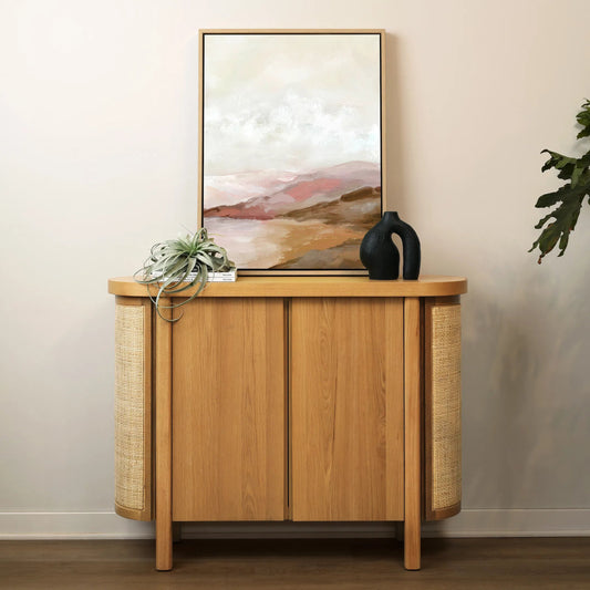 Elara Sideboard by Arch & Plane in natural. Made from rubber wood, oak veneer, cane in a unique style.