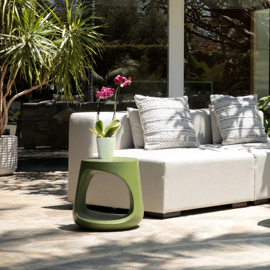 Owens Side Table by Arch & Plane in olive green. Made from lightweight concrete in a unique style.