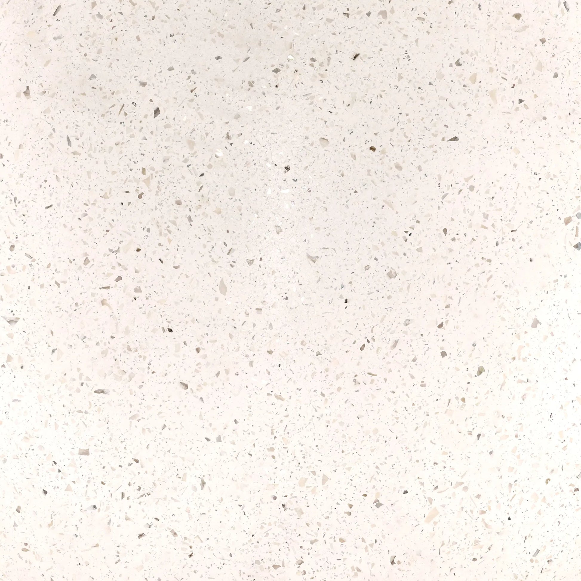 Quincy Outdoor Dining Table by Arch & Plane in ivory. Made from lightweight concrete terrazzo in a unique style.