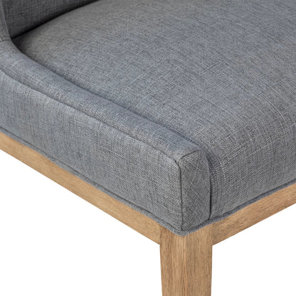 Eva Dining Chair by Arch & Plane in grey upholstery, natural wood finish. Made from cotton blend upholstery, rubberwood legs in a transitional style.