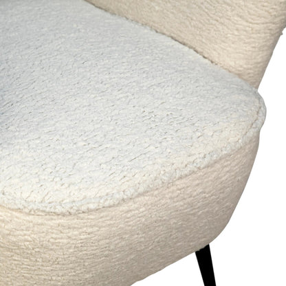 Zayne Faux Fur Occasional Chair by Arch & Plane in white, black and natural white faux fur, matte black finish. Made from faux sheepskin upholstery, solid hardwood in a modern style.