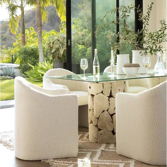 Thora Dining Chair by Arch & Plane. Made from boucle upholstery, solid pine wood in a transitional style.