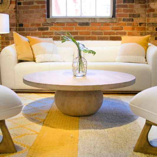 Rory Reclaimed Pine Round Coffee Table by Arch & Plane in light brown. Made from reclaimed pine in a modern style.