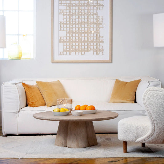 Lisette Reclaimed Pine Round Coffee Table with Clover Pedestal by Arch & Plane in light wash brown. Made from reclaimed pine in a modern style.