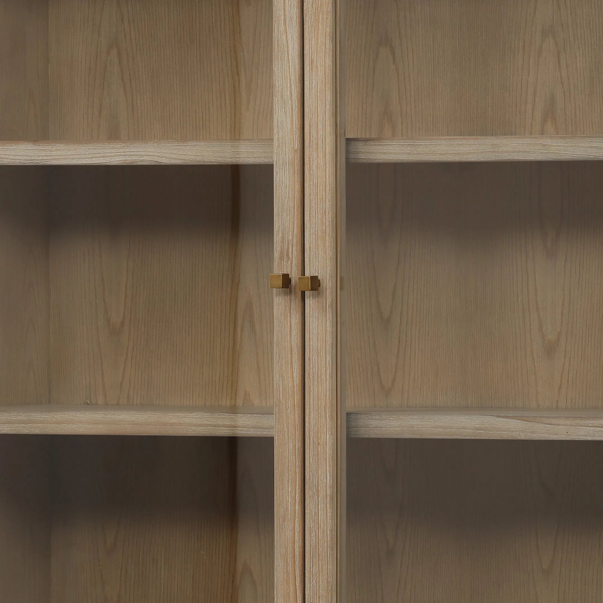 Makala Cabinet by Arch & Plane in warm brown wash. Made from reclaimed pine wood, glass, select hardwood in a unique style.