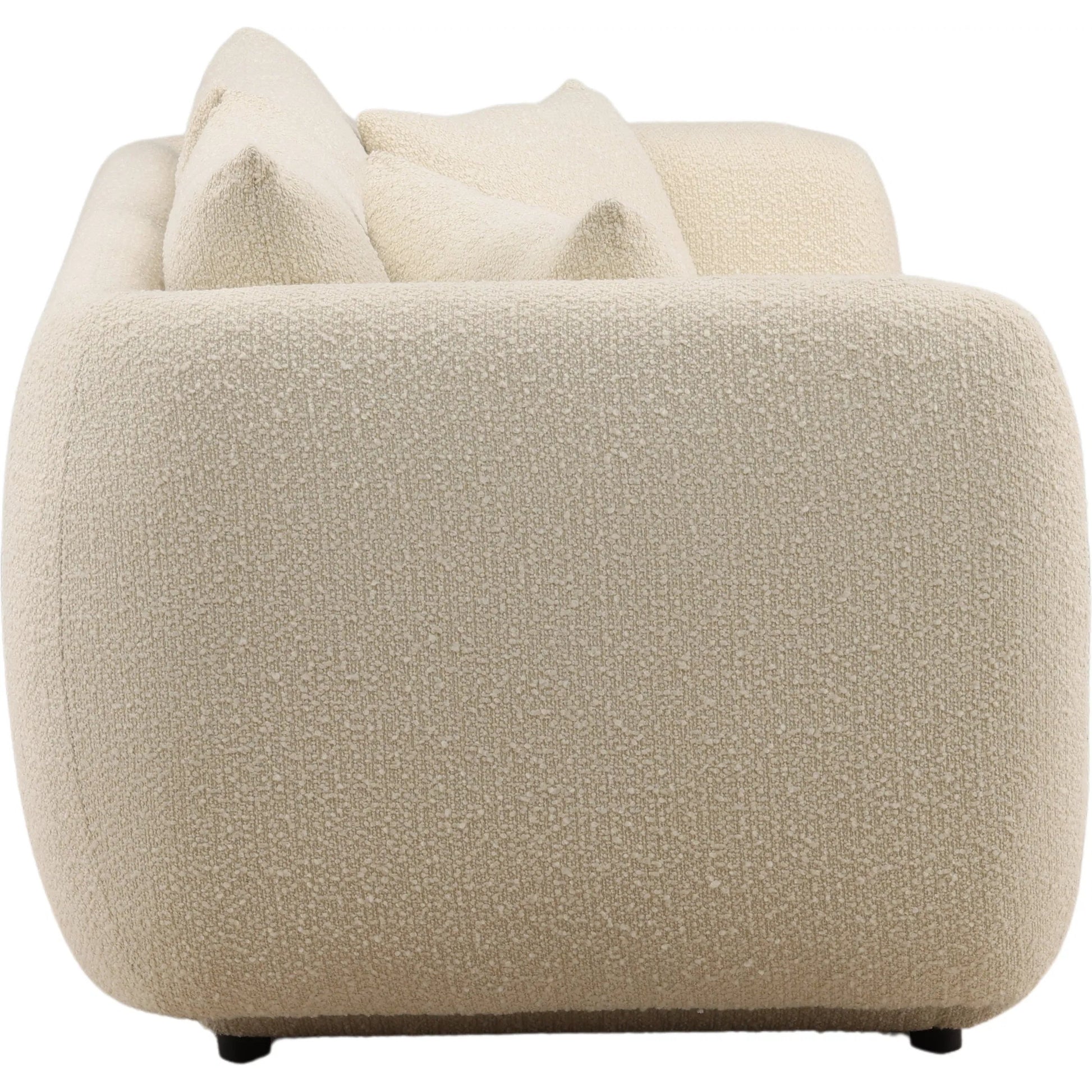 Deann Sofa by Arch & Plane. Made from boucle fabric in a unique style.
