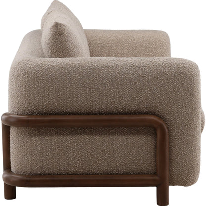 Neil Sofa by Arch & Plane in olana sand, brown. Made from boucle fabric, rubber wood in a unique style.
