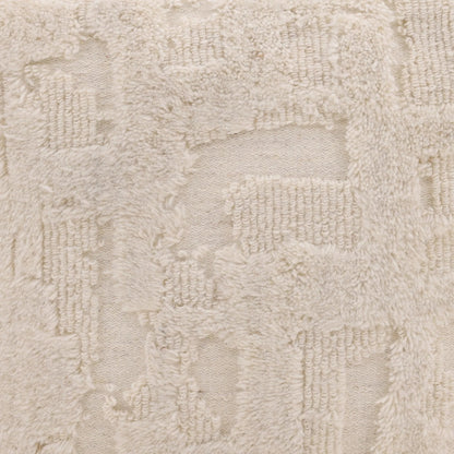 Winter Pouf by Arch & Plane in ivory. Made from handwoven wool in a rustic style.