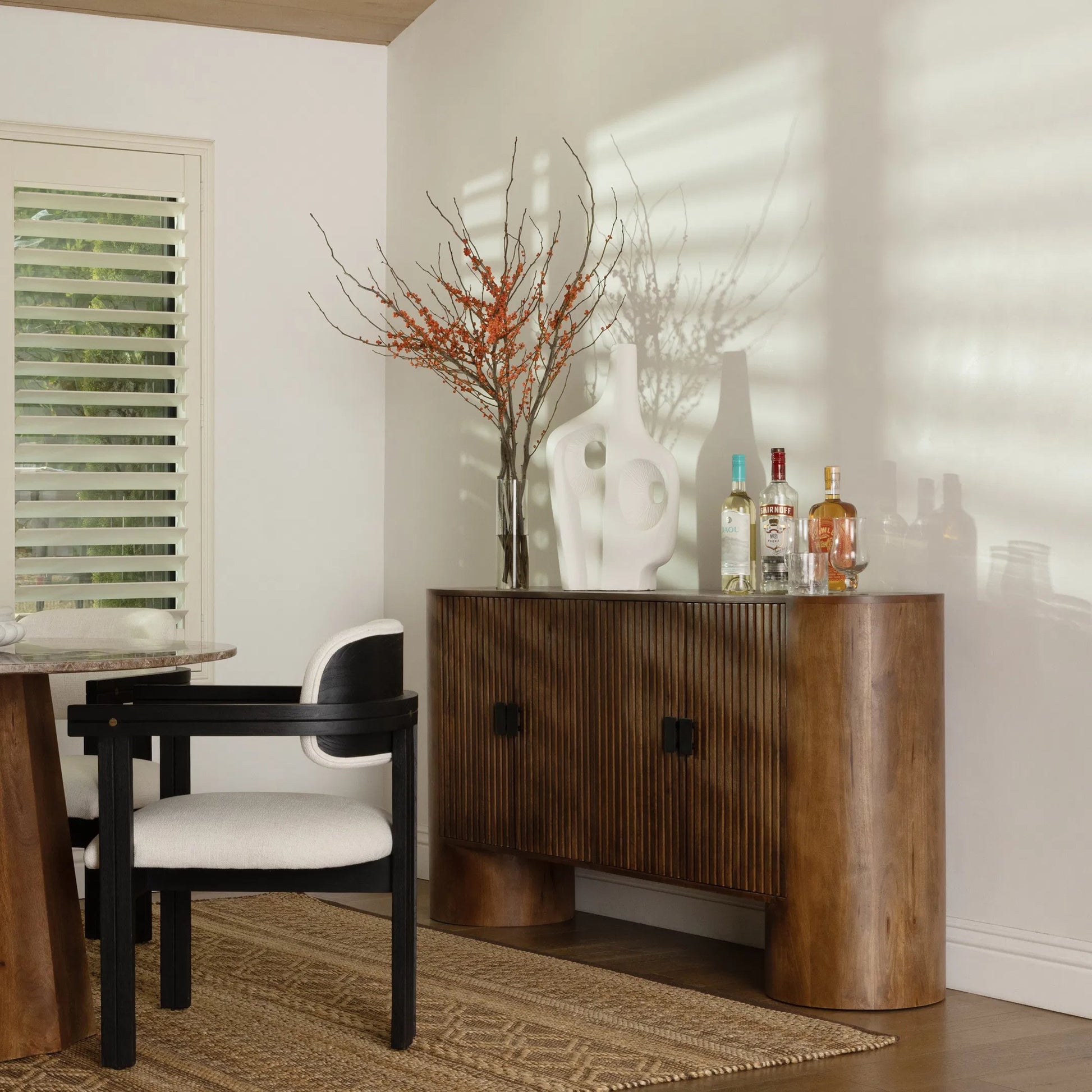 Lawson Sideboard by Arch & Plane in medium brown, black handles. Made from mango wood, metal in a traditional style.