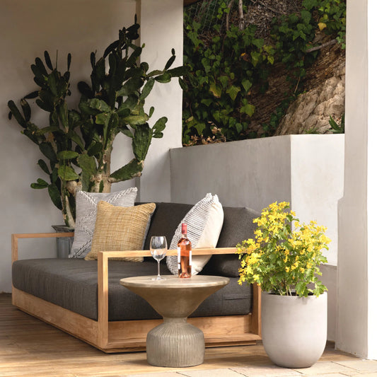 Kaycee Outdoor Gray Upholstered Teak Sofa by Arch & Plane in charcoal, natural teak. Made from solution, dyed acrylic upholstery, teak wood in a unique style.