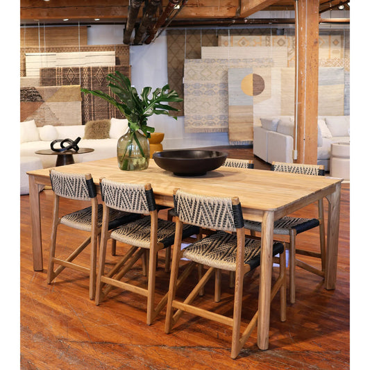 Brianna Outdoor Dining Table by Arch & Plane in natural. Made from teak wood in a unique style.