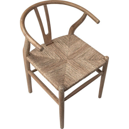 Leanne Oak and Wicker Wishbone Back Dining Arm Chair by Arch & Plane in medium brown and woven. Made from oak in a cottage & farmhouse style.