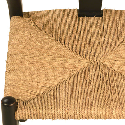 Leanne Oak and Wicker Wishbone Back Dining Arm Chair by Arch & Plane in medium brown and woven. Made from oak in a cottage & farmhouse style.