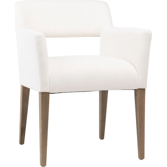 Reuben White Upholstered Dining Arm Chair by Arch & Plane in natural white, natural wood and fabric. Made from cotton blend in a modern style.