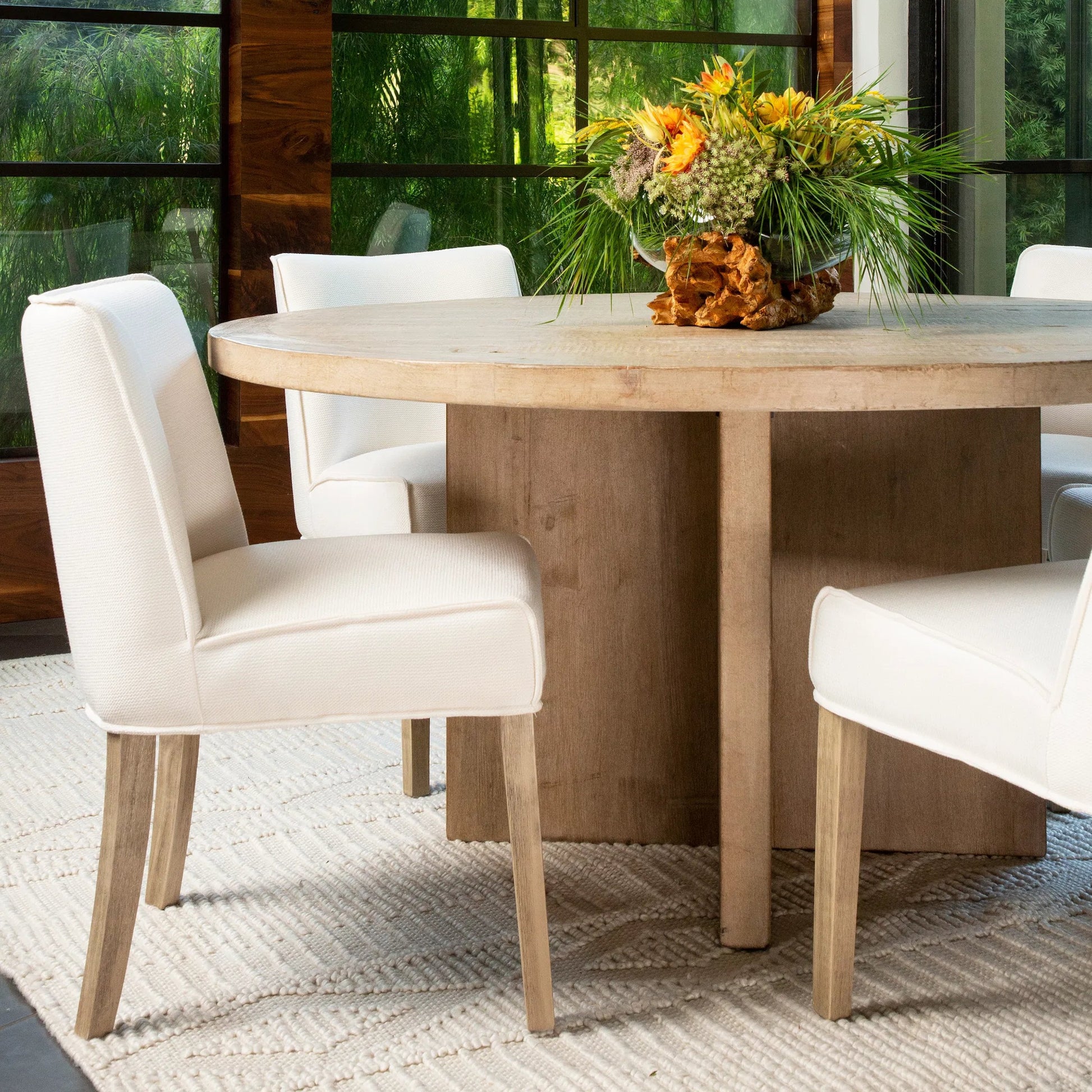 Dena 60" Round Reclaimed Pine Dining Table by Arch & Plane. Made from reclaimed pine in a modern style.