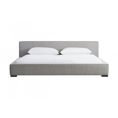 Zest Wide Upholstered Bed by Zest. Made from rubberwood, fabric in a modern style.