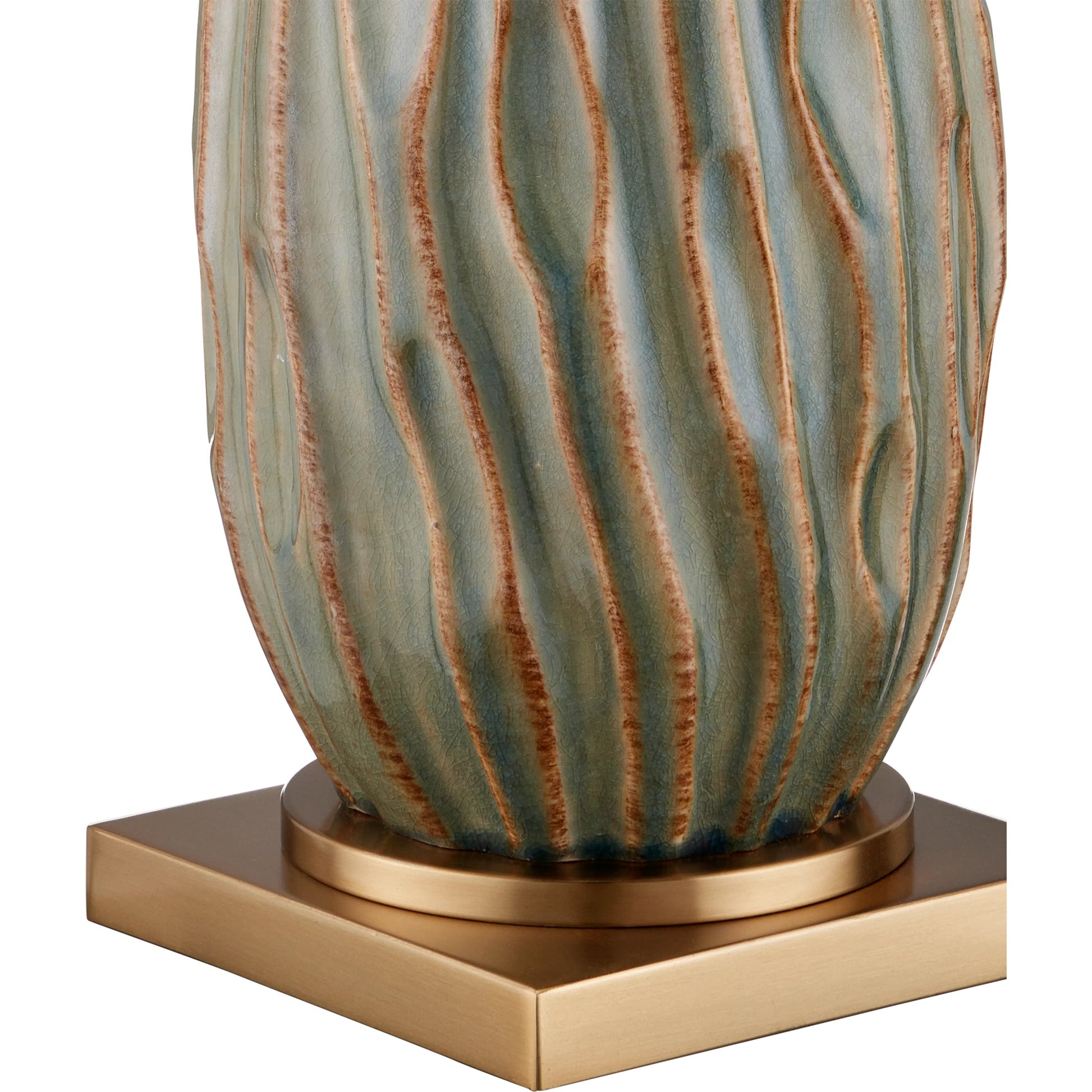 Water-Borne Table Lamp by Currey and Company in forest reactive, antique brass. Made from ceramic, metal in a modern style.