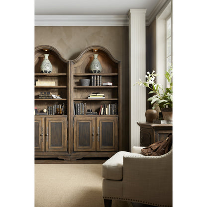 Pleasanton Bookcase by Hooker Furniture in saddle brown. Made from white oak veneers, glass, resin in a traditional style.