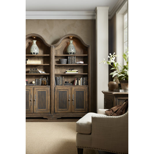 Pleasanton Bookcase by Hooker Furniture in saddle brown. Made from white oak veneers, glass, resin in a traditional style.