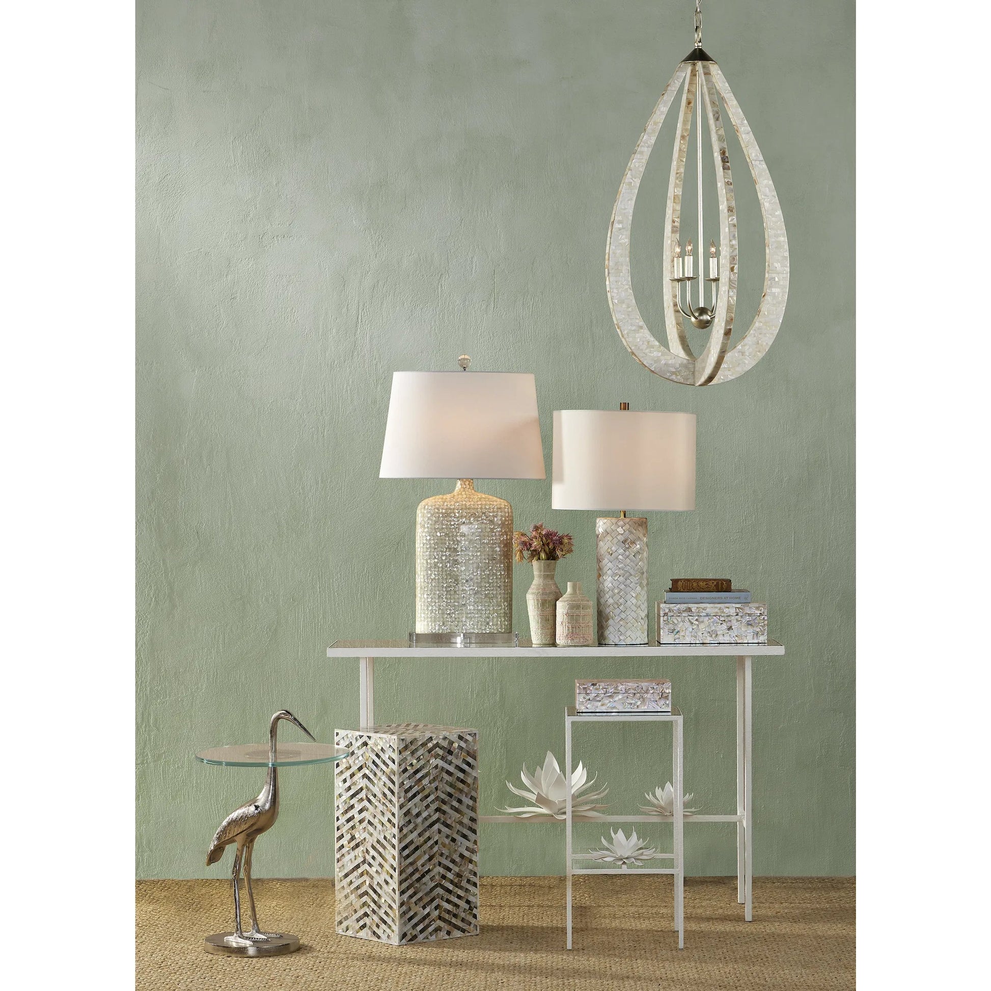 Crane Accent Table by Currey and Company. Made from cast aluminum, glass in a modern style.