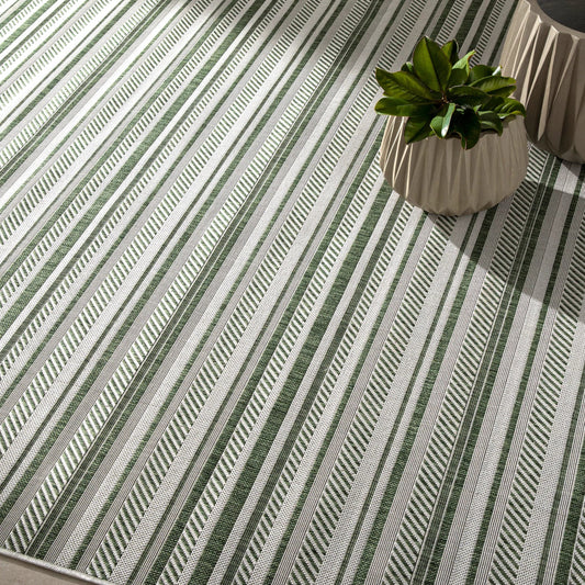 Eagean Rug by Livabliss in grass green, ivory, dark green, seafoam. Made from face: 100% polypropylene in a eclectic & global style.