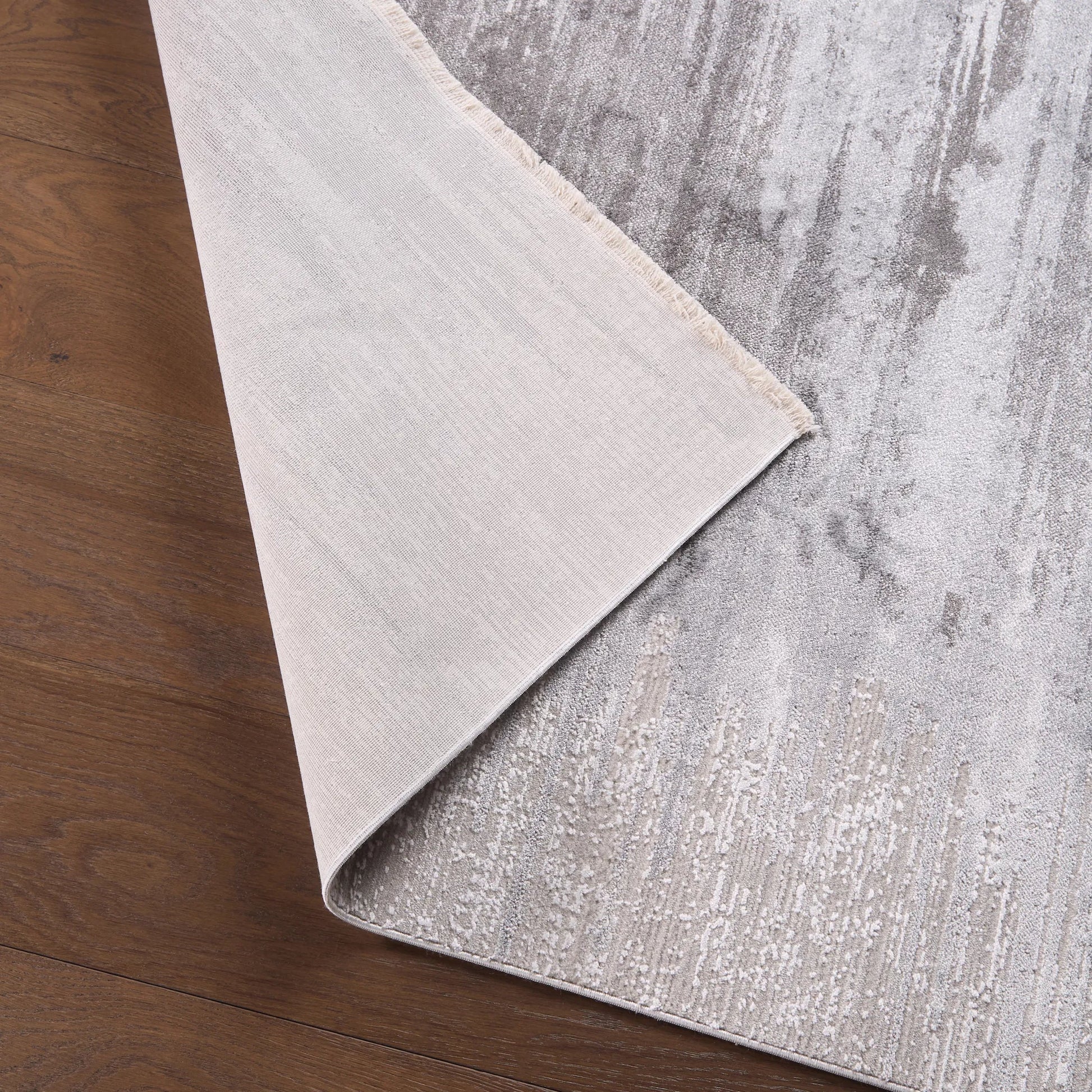 En Blanc EBC13 Rug by Jaipur Living in light gray, taupe, white. Made from 70% viscose, 30% polyester in a unique style.