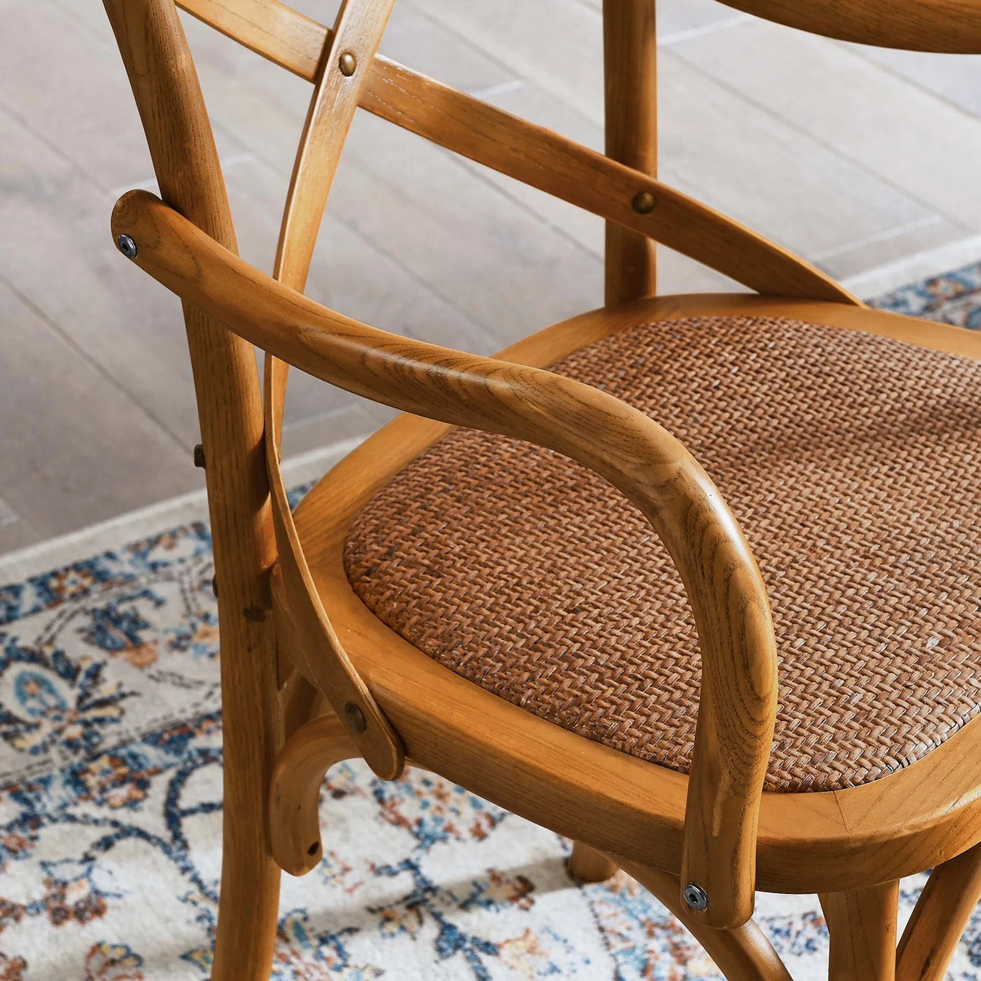 Easton Dining Armchair by Evans & Londeen in walnut. Made from chinese toon, plywood, rattan in a cottage & farmhouse style.