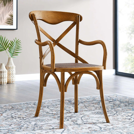 Easton Dining Armchair by Evans & Londeen in walnut. Made from chinese toon, plywood, rattan in a cottage & farmhouse style.