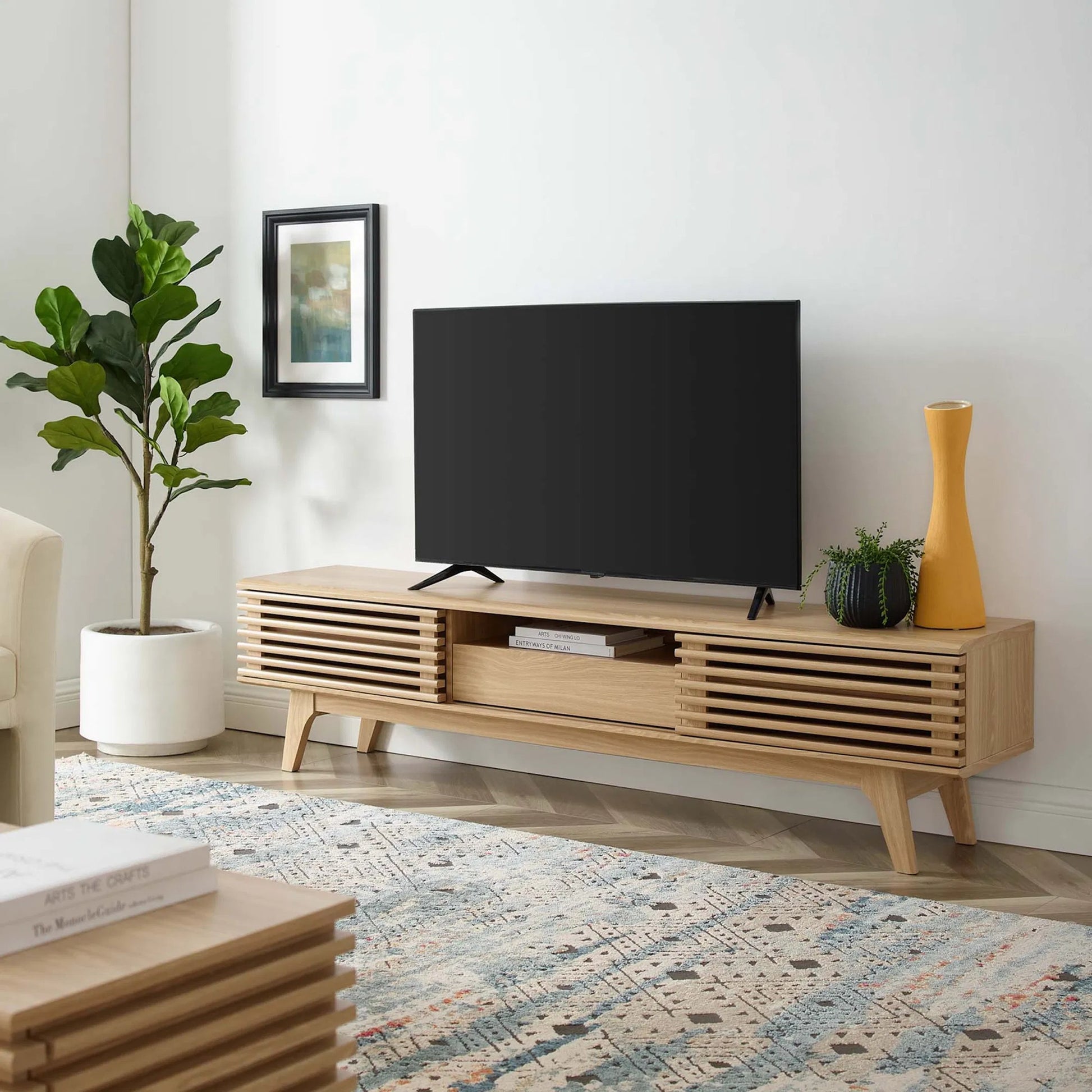 Rennell 70" TV Stand by Evans & Londeen. Made from particle board, mdf in a modern style.