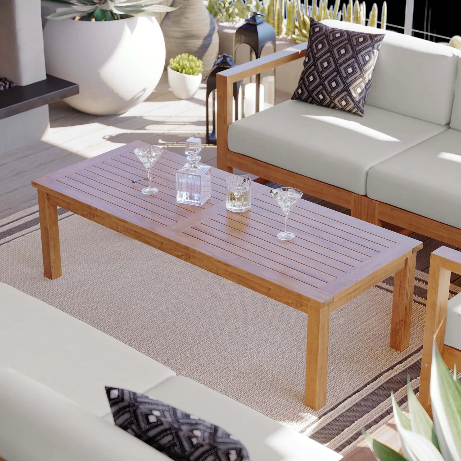 Natalia Teak Wood Coffee Table by Evans & Londeen in natural. Made from unique in a coastal style.