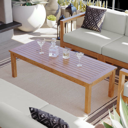 Natalia Teak Wood Coffee Table by Evans & Londeen in natural. Made from unique in a coastal style.