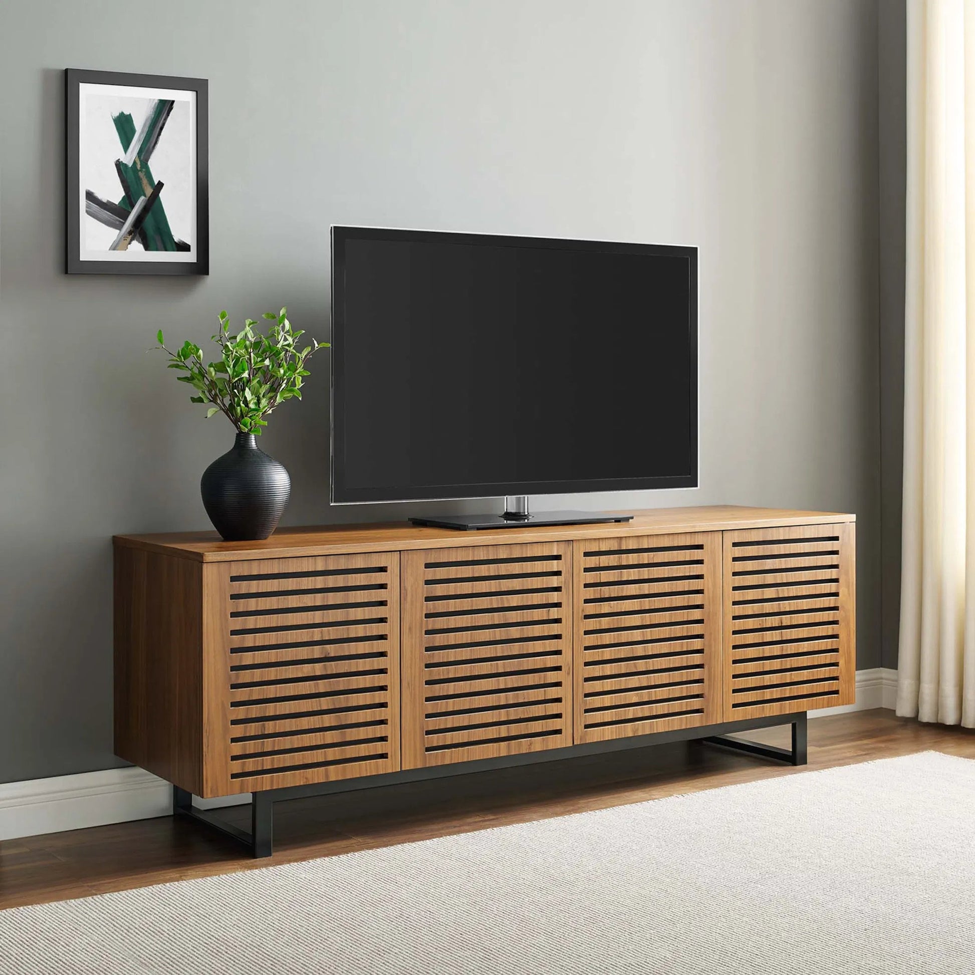 Henry 73" TV Stand by Evans & Londeen in walnut. Made from the body is 0.5in mdf with walnut wood veneer, legs is 40*20*1.2mm iron tube powder coated in black color in a modern style.