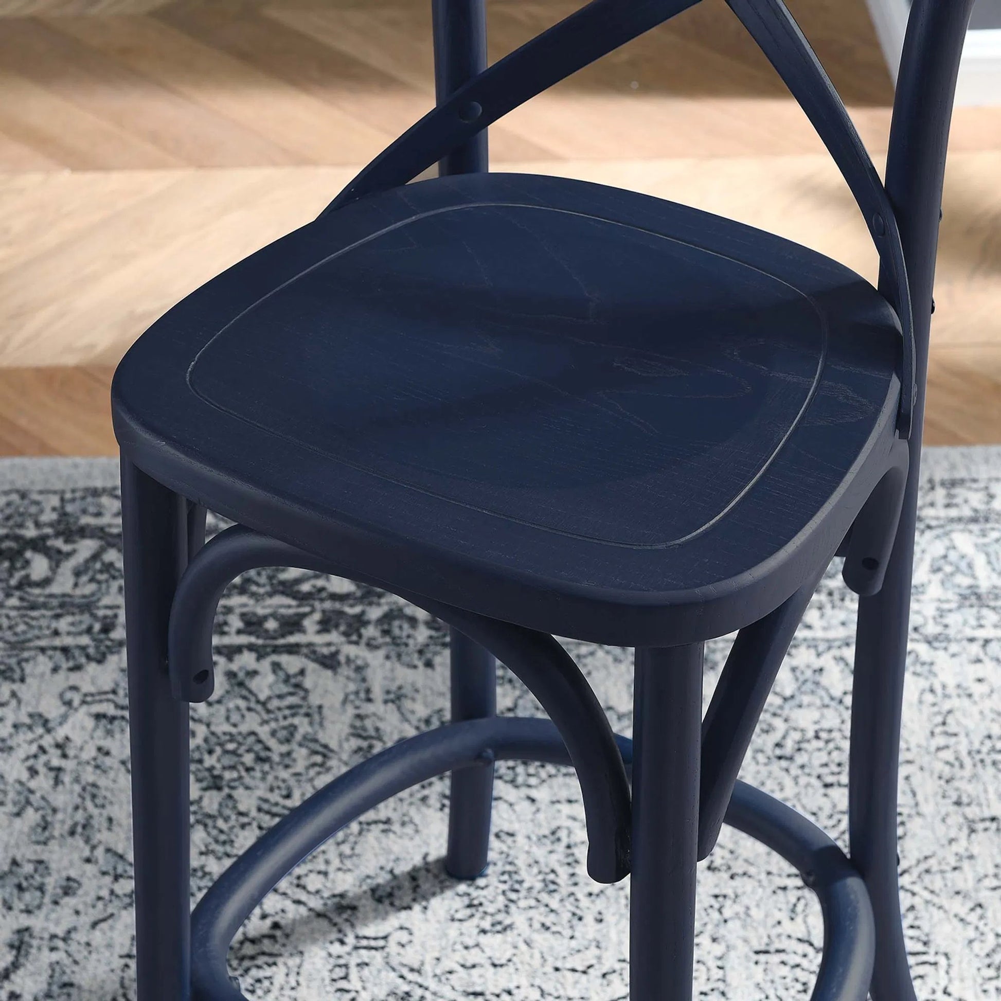 Easton Counter Stool by Evans & Londeen. Made from seat board is chinese elm wood, white foot pins in a transitional style.