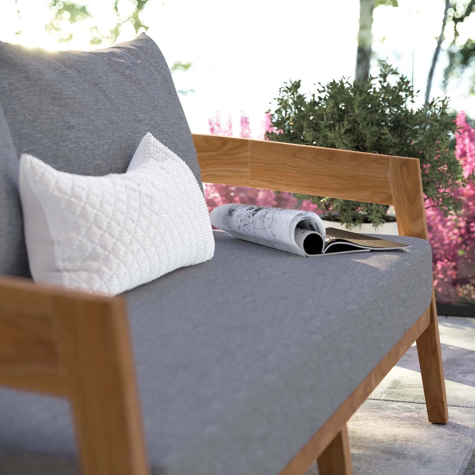 Hazelton Teak Wood Loveseat by Evans & Londeen. Made from teak wood, polyester, mesh sling, plastic tack glides, stainless steel in a modern style.
