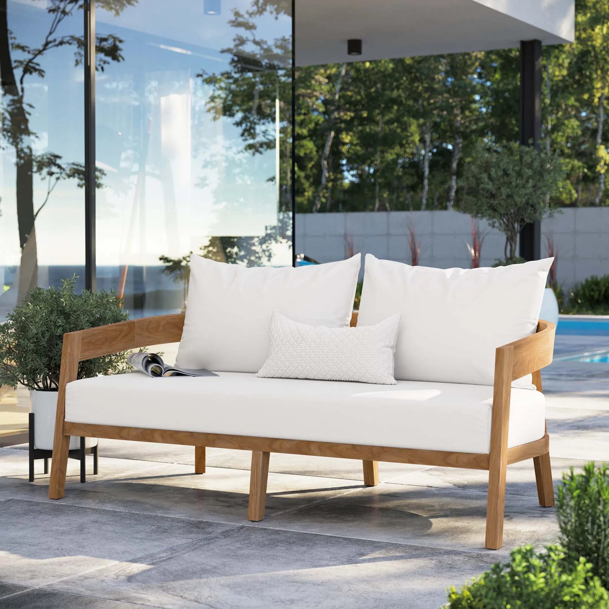 Hazelton Teak Wood Loveseat by Evans & Londeen. Made from teak wood, polyester, mesh sling, plastic tack glides, stainless steel in a modern style.