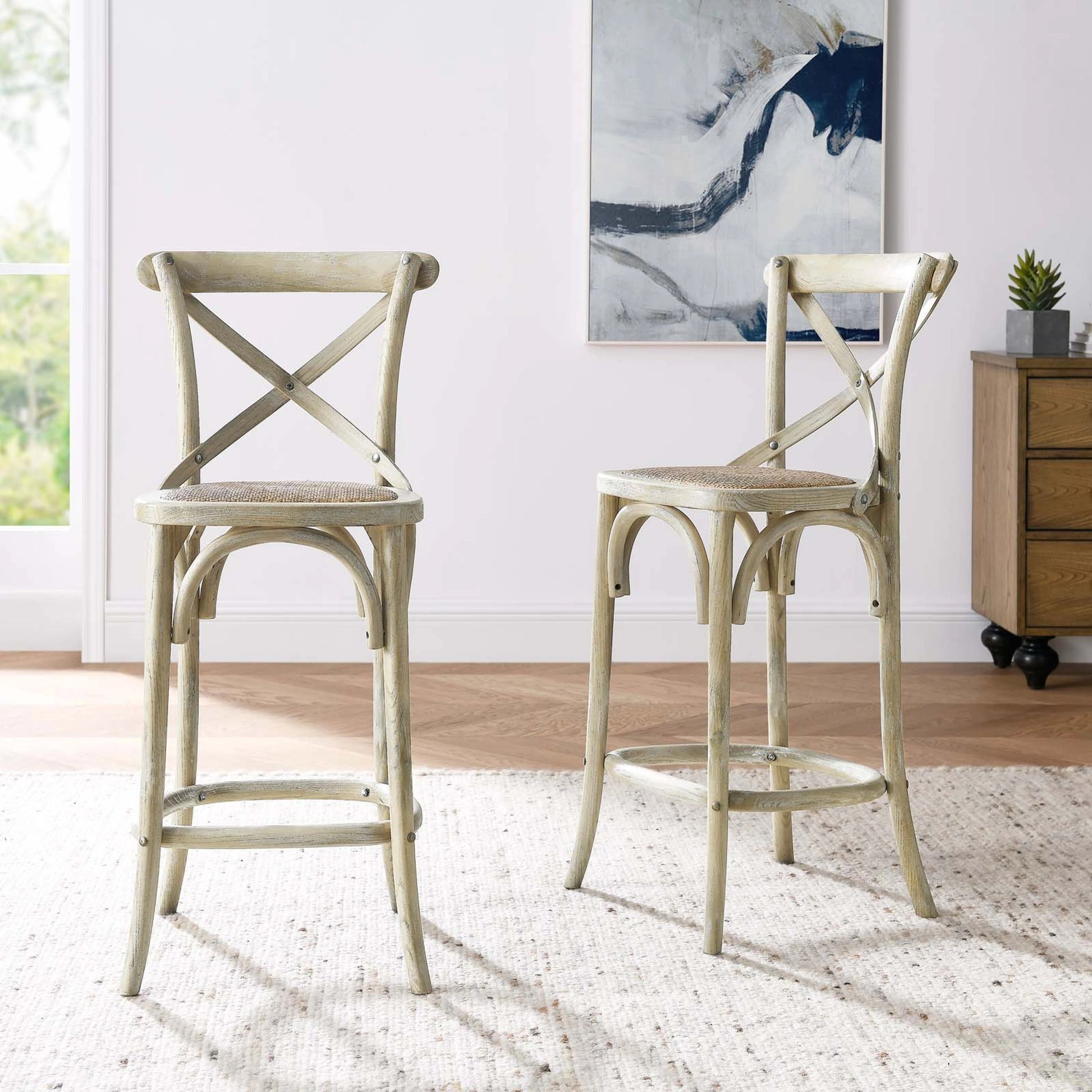 Easton Counter Stool by Evans & Londeen. Made from seat board: edge chinese elm wood, middle p2 plywood, top rattan, white foot pins in a transitional style.