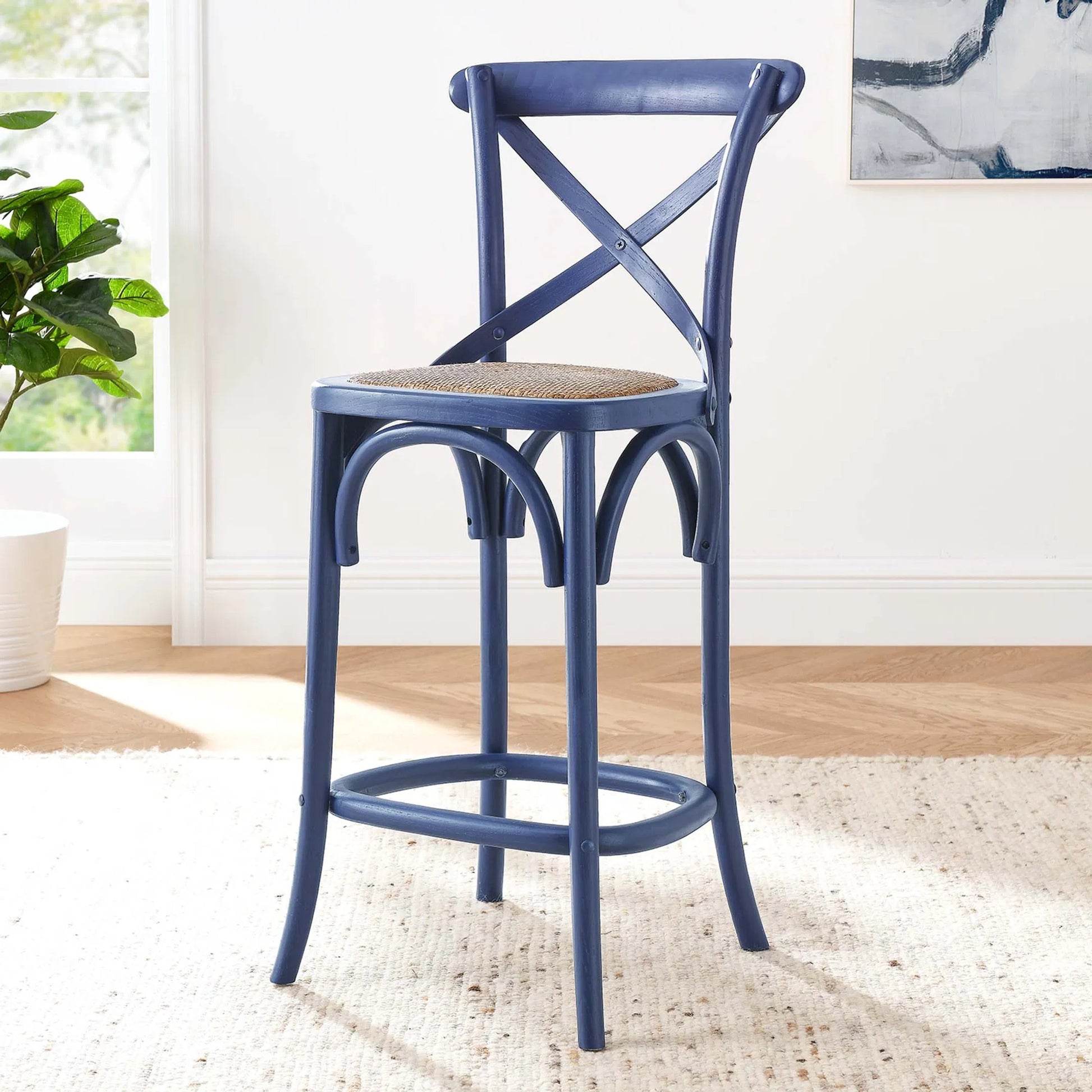 Easton Counter Stool by Evans & Londeen. Made from seat board: edge chinese elm wood, middle p2 plywood, top rattan, white foot pins in a transitional style.