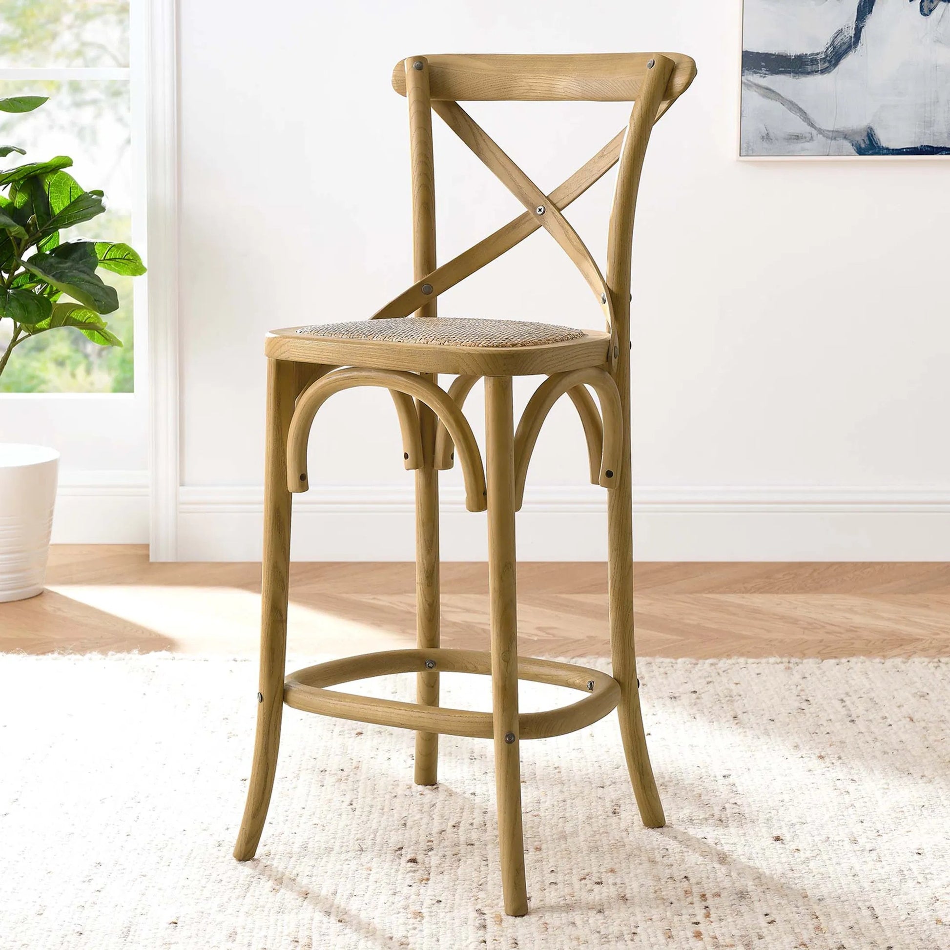 Easton Counter Stool by Evans & Londeen. Made from seat board: edge chinese elm wood, middle p2 plywood, top rattan, white foot pins in a transitional style.