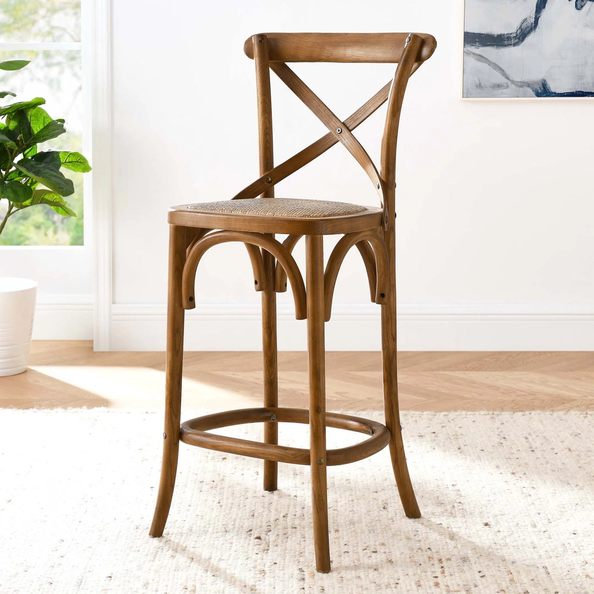 Easton Counter Stool by Evans & Londeen. Made from seat board: edge chinese elm wood, middle p2 plywood, top rattan, white foot pins in a transitional style.