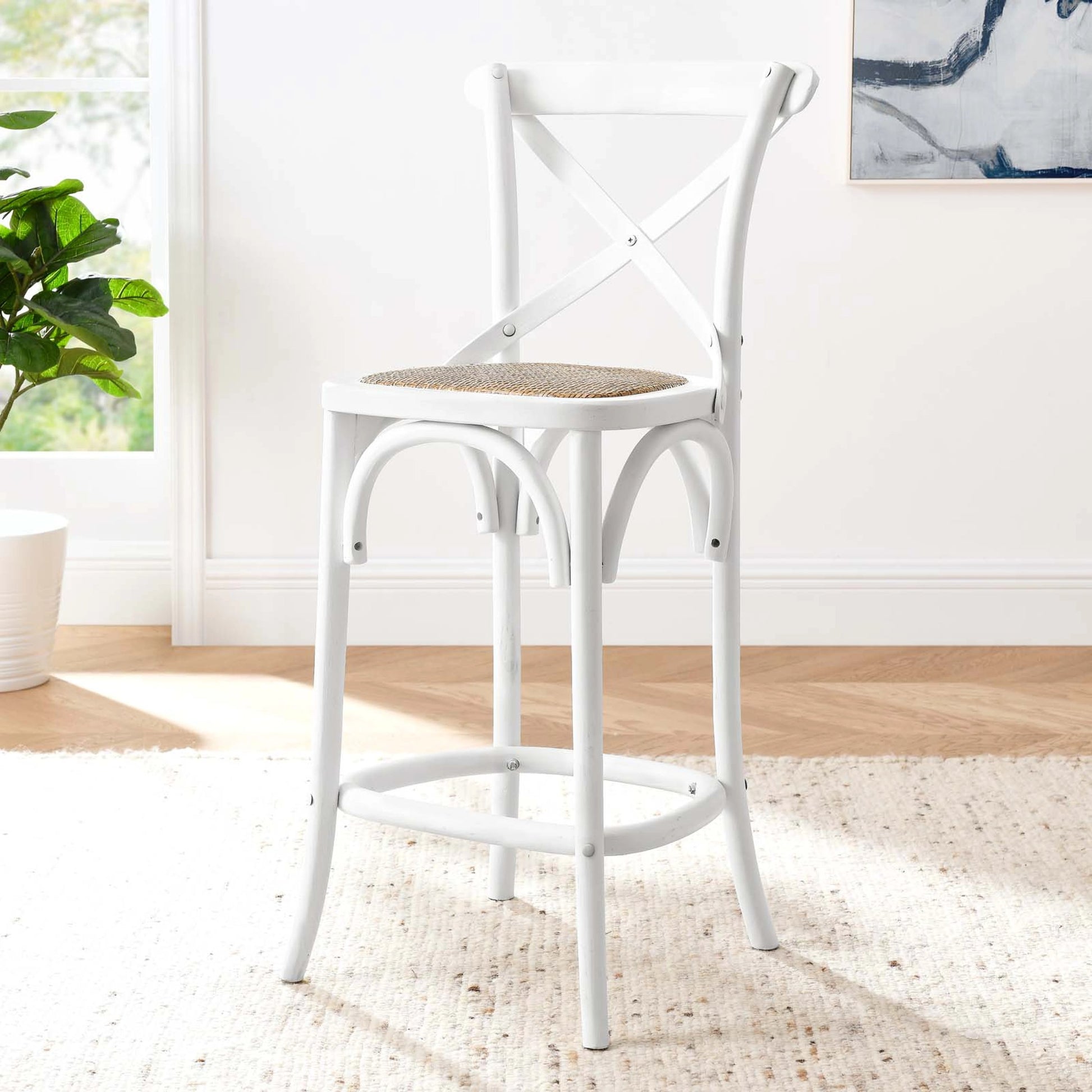 Easton Counter Stool by Evans & Londeen. Made from seat board: edge chinese elm wood, middle p2 plywood, top rattan, white foot pins in a transitional style.
