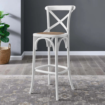 Easton Bar Stool by Evans & Londeen. Made from edge chinese elm wood, middle p2 plywood, top rattan, white foot pins in a cottage & farmhouse style.