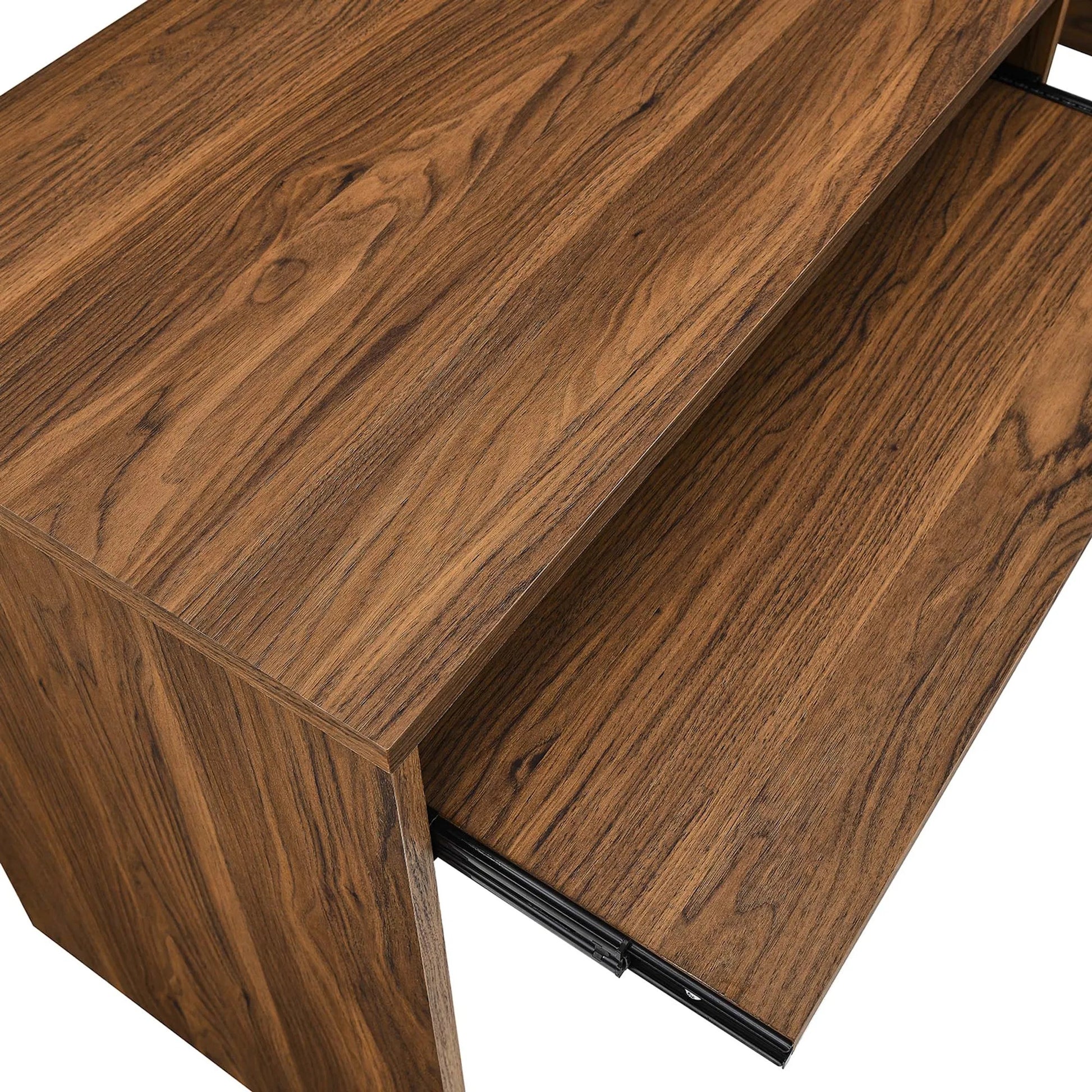 Nicholas L-Shaped Wood Office Desk by Evans & Londeen in walnut. Made from particle board, mdf, engineering wood with straight profile, pp toppan walnut, paper lamination, keyboard tray, tray runner, grommet cover, weight capacity: 150