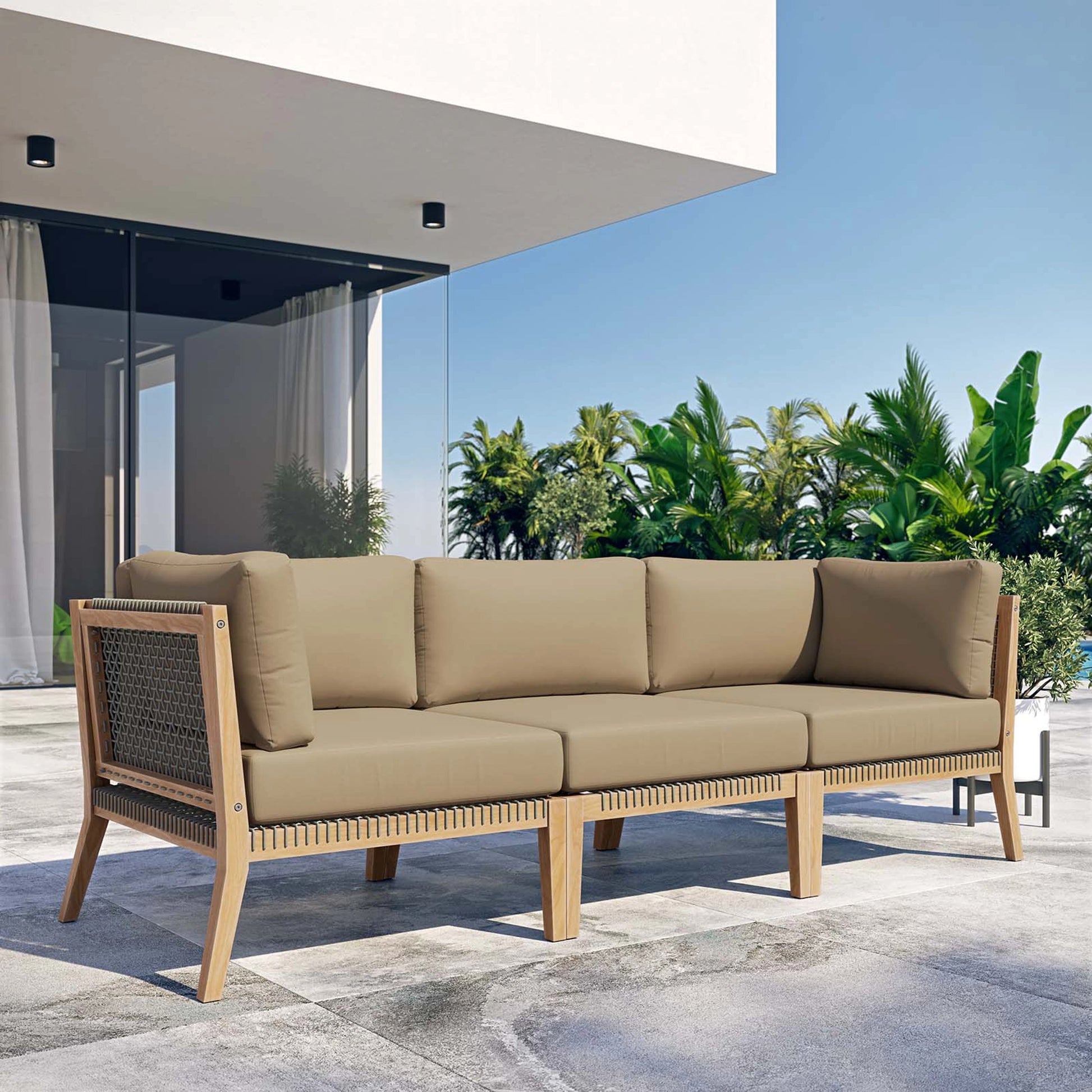 Cooper Teak Wood Sofa by Evans & Londeen. Made from teak wood, rope, quick dry foam, tack glides in a modern style.